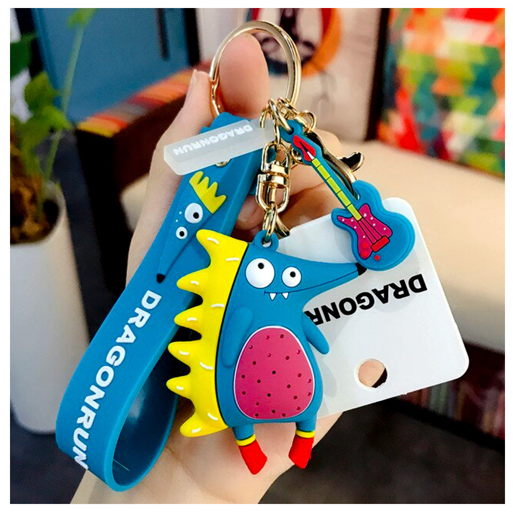 Close up of hedgehog keyring in teal held up by a small female hand