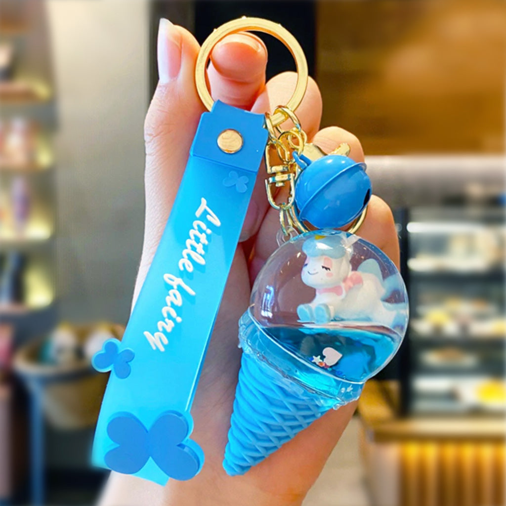 Blue unicorn ice-cream keyring with hand
