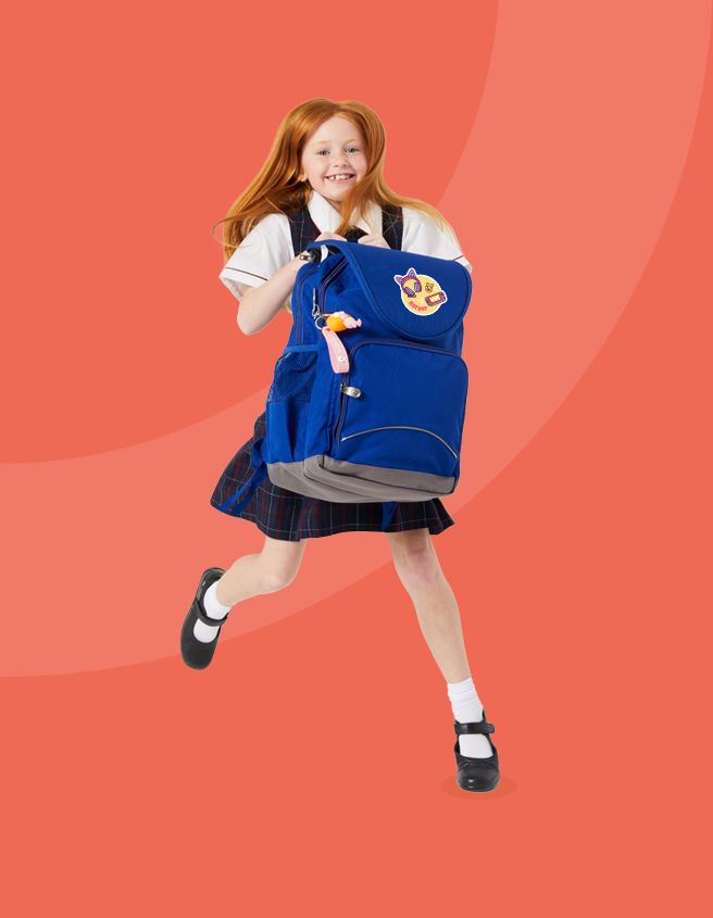 Happy Australian girl jumping with blue school bag