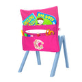 Back angle view of the Harlequin Chair Bag in pink with personalisation. View displaying two pockets, D-Ring and name bar, as well as books, scissors, pens and pencils packed into the pockets.