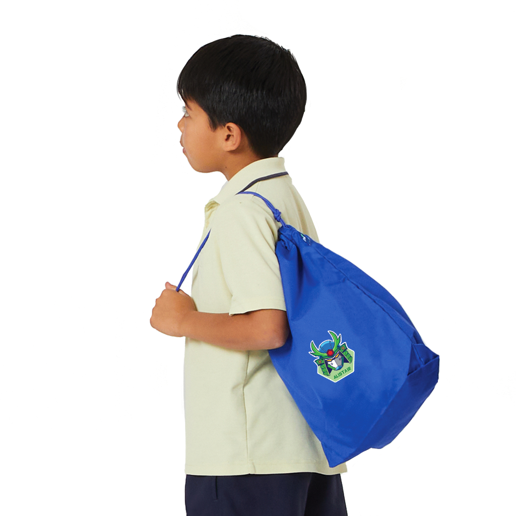 7 year old child model in school uniform wearing over his shoulder the Harlequin Eco Gym bag in royal blue with personalisation.
