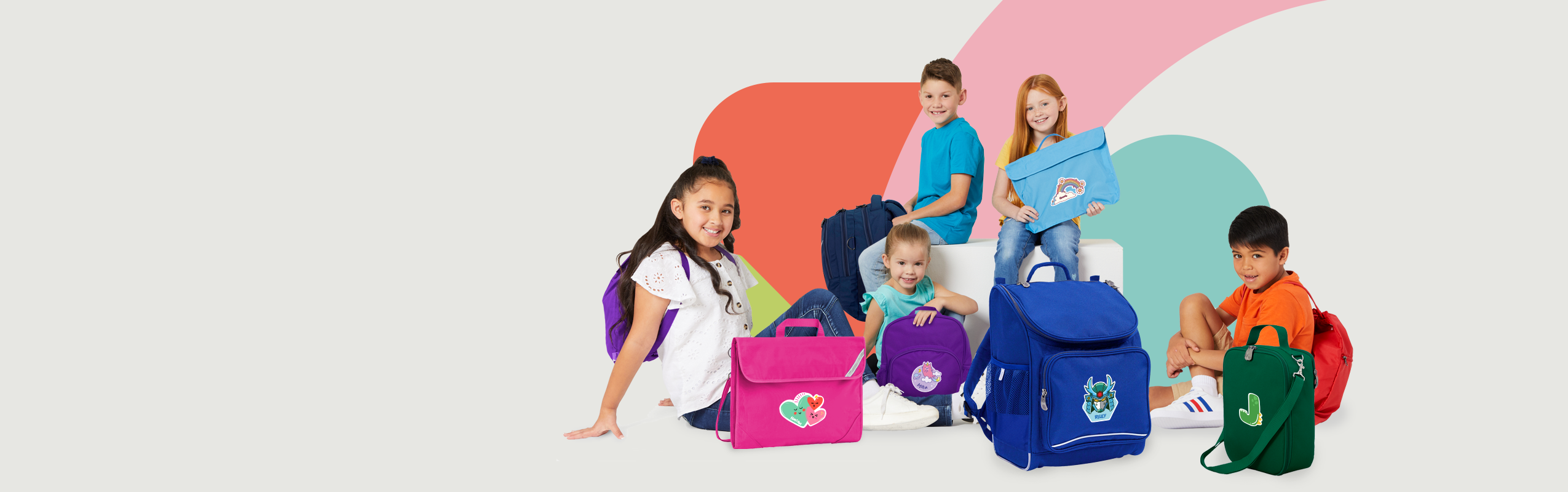 Group of Australian school kids carrying backpacks, lunch bags, book bags and library bags