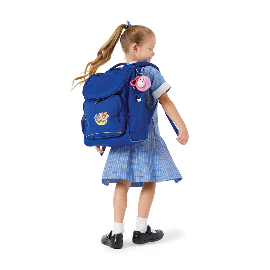 Harlequin Mighty Junior Tuff-Pack Backpack in Royal Blue with personalisation, being worn by a 5 year old child model in school uniform.