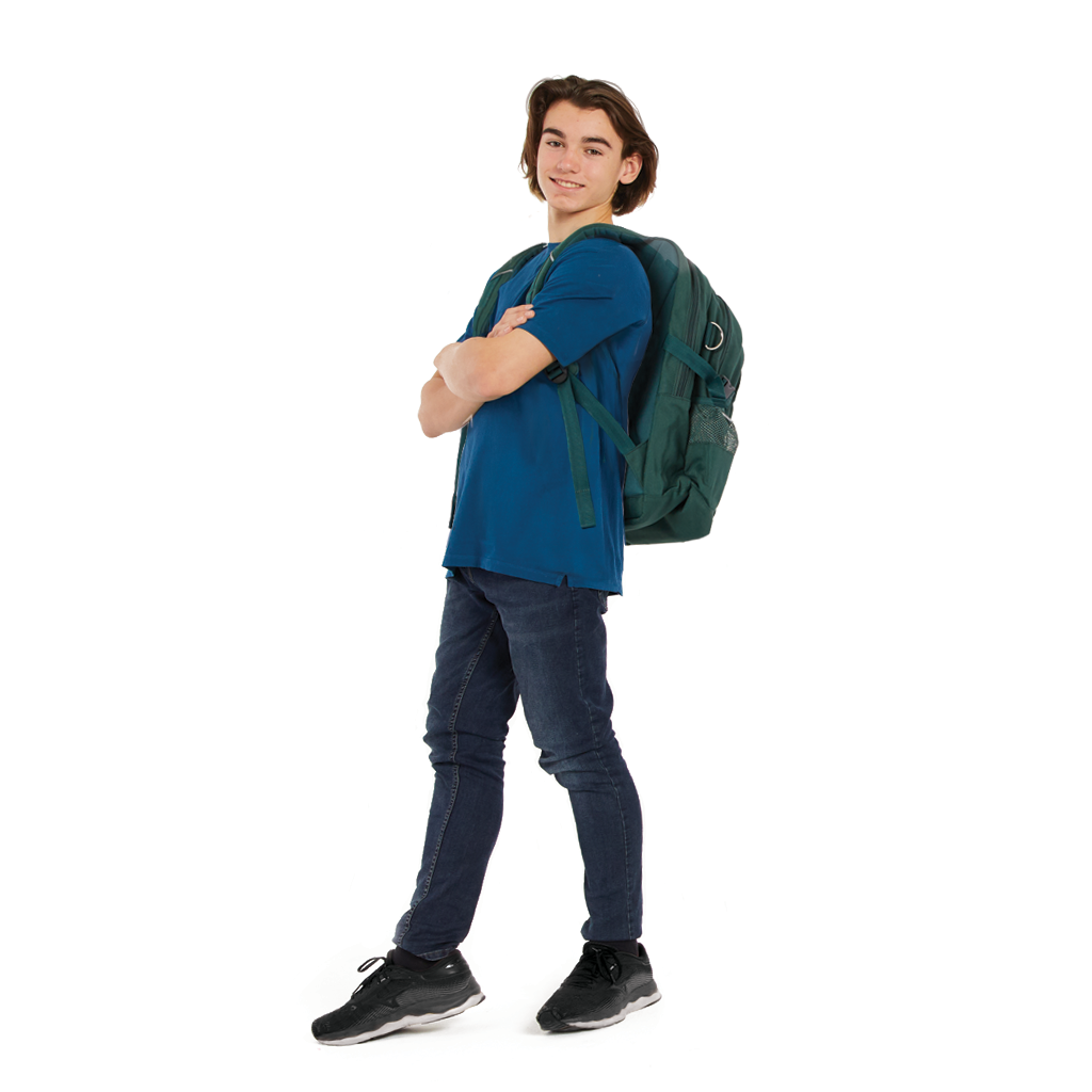 Tall young man wears a harlequin bottle green ergonomic school bag and backpack on his shoulders. He wears a blue shirt and jeans. He looks happy and confident.