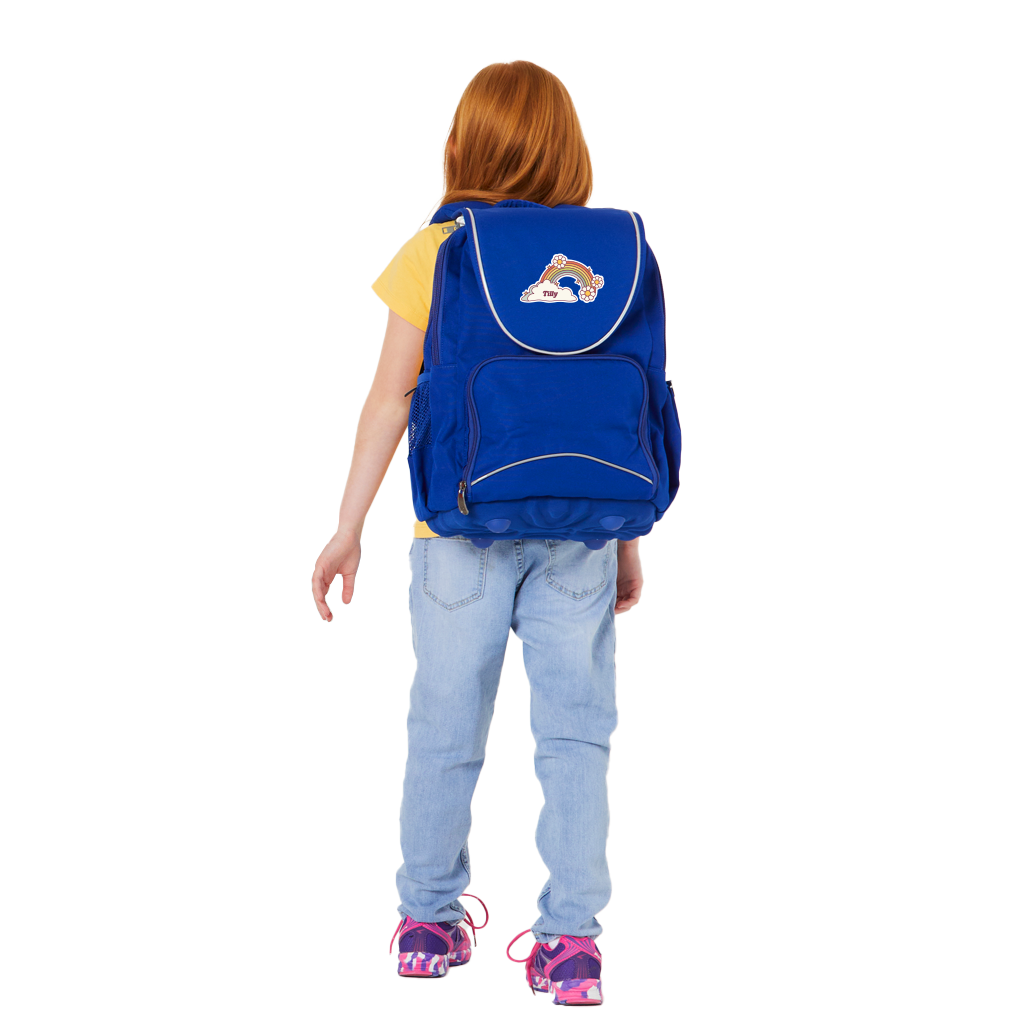 8 year old child model in casual clothing wearing on her back the Harlequin VIVID Ergo Backpack in royal blue with personalisation.