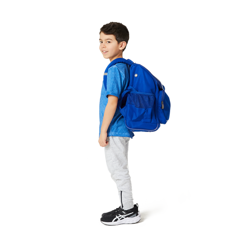 Harlequin VIVID Mighty backpack in Navy being worn by a 7 year old child model in a profile side view.