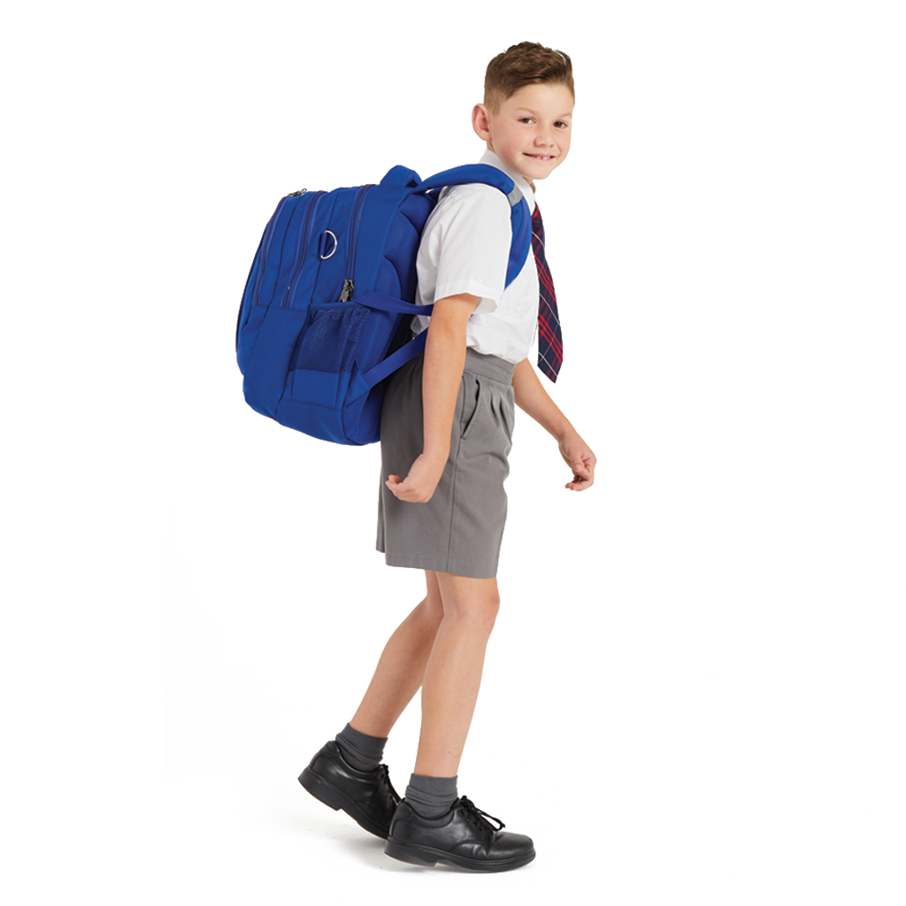 8 year old child model in school uniform walking sideways, wearing on his back the Harlequin Royal Blue Anatomic Medium backpack.