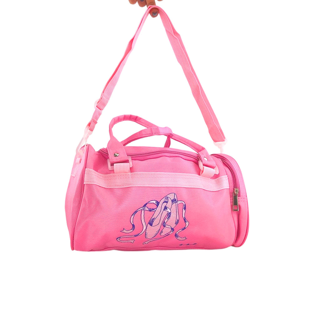 Ballet dance bag with special ballet design details angled with pink handles and side pocket with zipper. The bag also has a detachable and adjustable strap