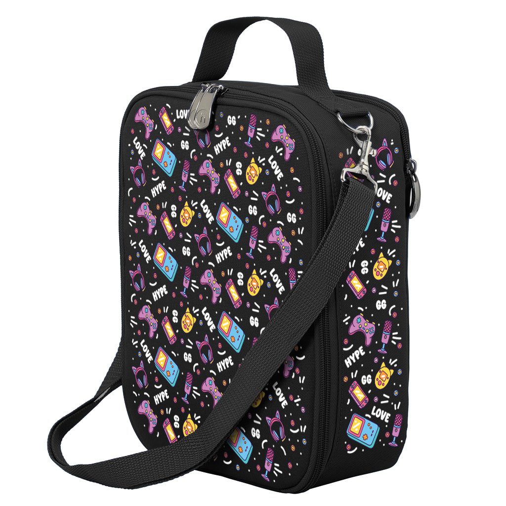 Harlequin Large Lunch bag in Black with Pixel Chick design from the Harlequin Creatix Signature Series. Front angle view displaying top handle, quality zippers and D-Rings with additional shoulder strap.
