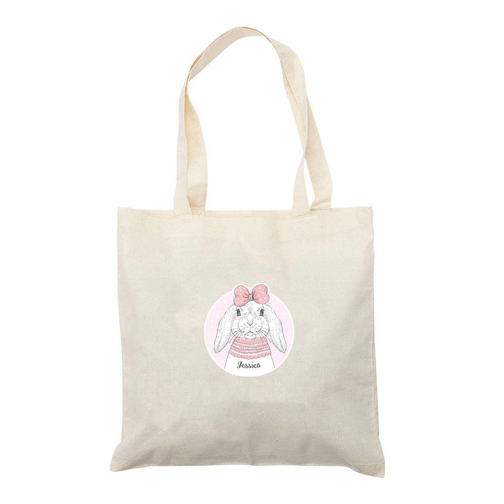 Harlequin Calico bag in natural colour displaying long shoulder handles and a personalisation on the front