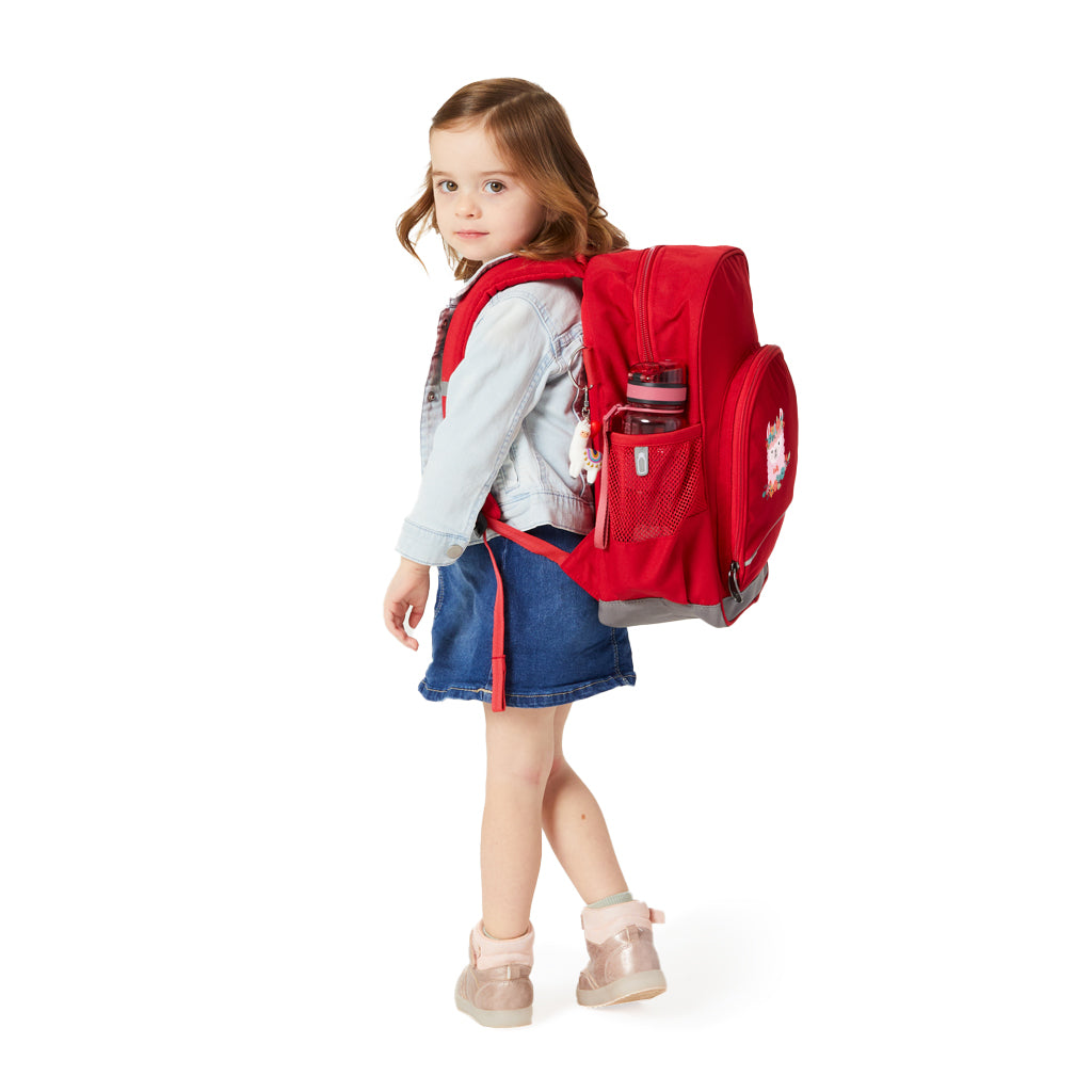 Harlequin Kindy Tuff-Pack Backpack in red, being worn by a 3 years old child model