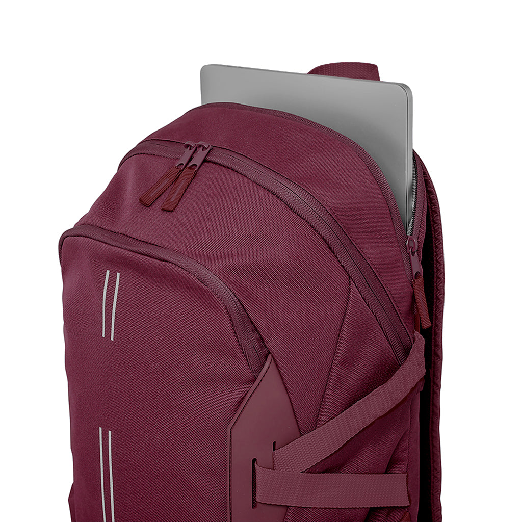 Navy Harlequin Quantum Bag angled view with two compartments with zip closure, light reflectors on the front pocket and adjustable straps and hidden laptop pocket