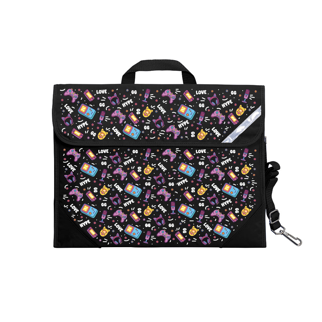 Harlequin Safety Library bag in Black with Pixel Chick design from the Harlequin Creatix Signature Series. Front angle view displaying carry handle, easy open velcro strap, reflector safety strip, reinforced corners and shoulder strap.