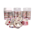 Decorative tape rolls with floral designs and packaging on a white background