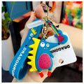 Close up of hedgehog keyring in teal held up by a small female hand