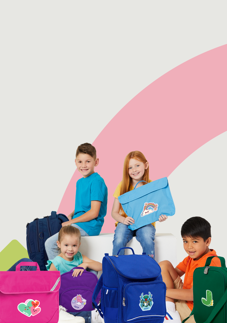 Group of Australian school kids carrying backpacks, lunch bags, book bags and library bags