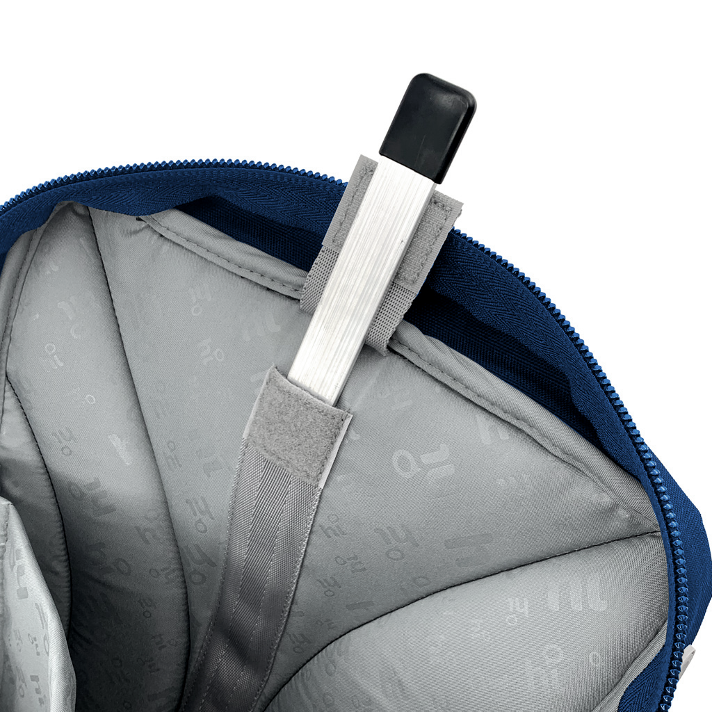 Close-up of a gray backpack with a blue zipper open, showing a silver spinal rod