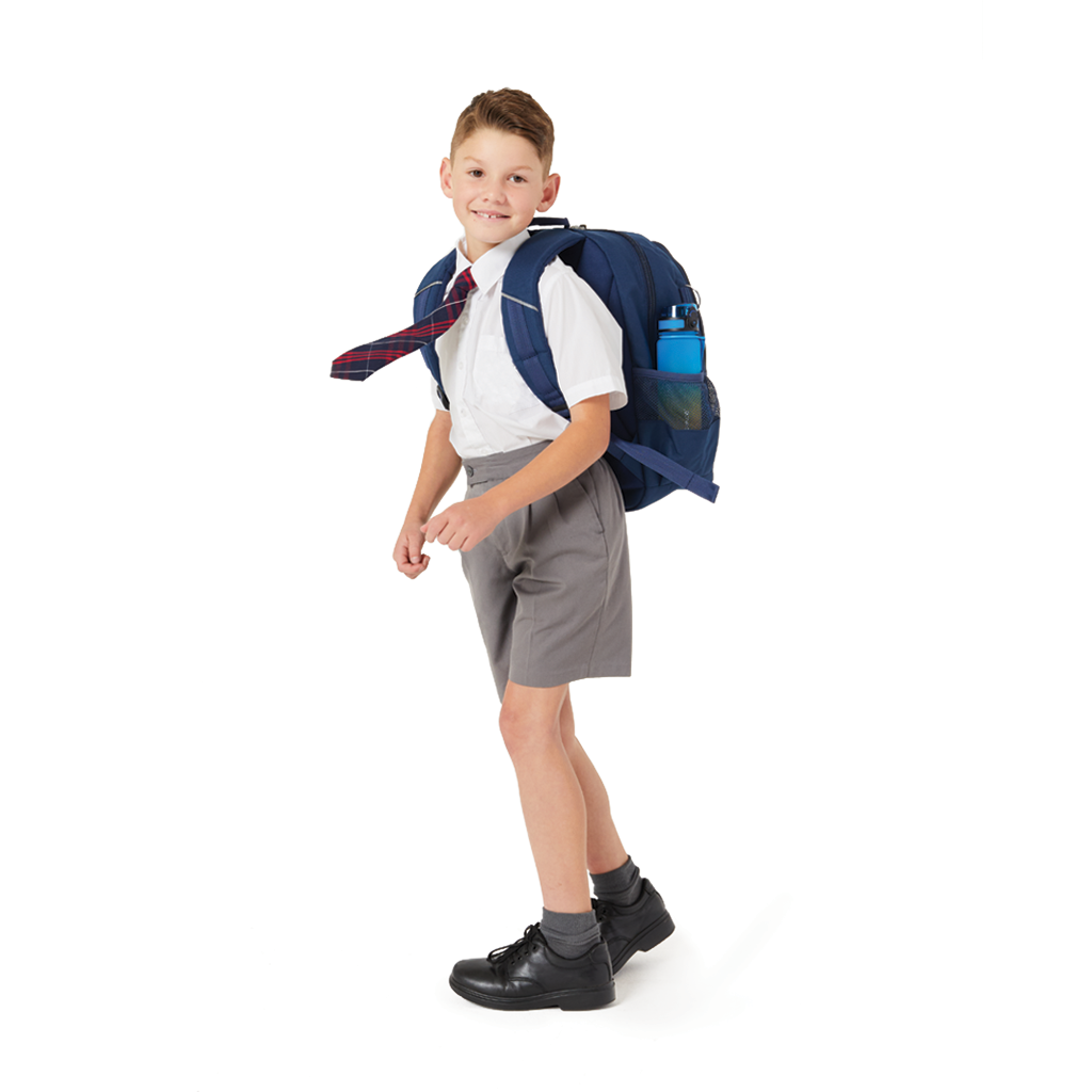 8 year old child model in school uniform wearing on his back the Harlequin Genius primary backpack in navy.