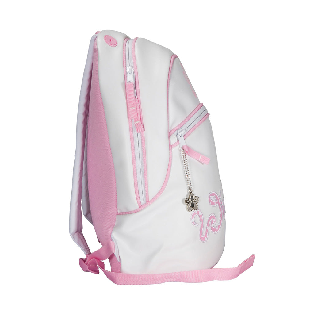 White and Pink Polkadot Winkipop surf backpack side view displaying one side pocket and one front pocket with flower shaped zipper puller