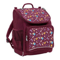Harlequin Mighty Tuff-Pack Junior Backpack in Maroon with the Pixel Chick design from the Harlequin Creatix signature series. Front side angle displaying carry handle, padded shoulder straps, top zipper compartment, front zipper pocket and mesh water bottle holder.
