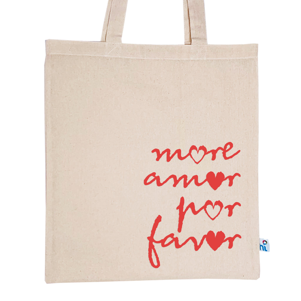 Harlequin Calico bag in natural colour displaying long shoulder handles with large More Amor Por Favor Design 