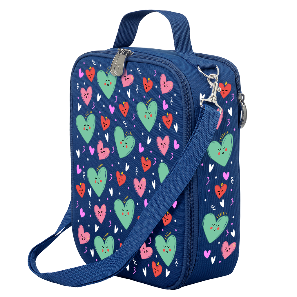 Harlequin Large Lunch bag in Navy with Sweet Hearts design from the Harlequin Creatix Signature Series. Front angle view displaying top handle, quality zippers and D-Rings with additional shoulder strap.