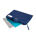Q Book Bag in Navy with handle, name plate and logo, unzipped with a laptop and book inserted