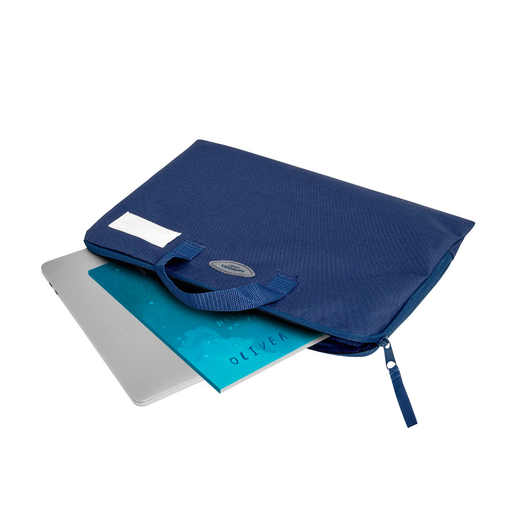 Q Book Bag in Navy with handle, name plate and logo, unzipped with a laptop and book inserted