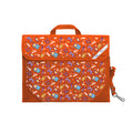 Harlequin Safety Library bag in Orange with Pixel Chick design from the Harlequin Creatix Signature Series. Front angle view displaying carry handle, easy open velcro strap, reflector safety strip, reinforced corners and shoulder strap.