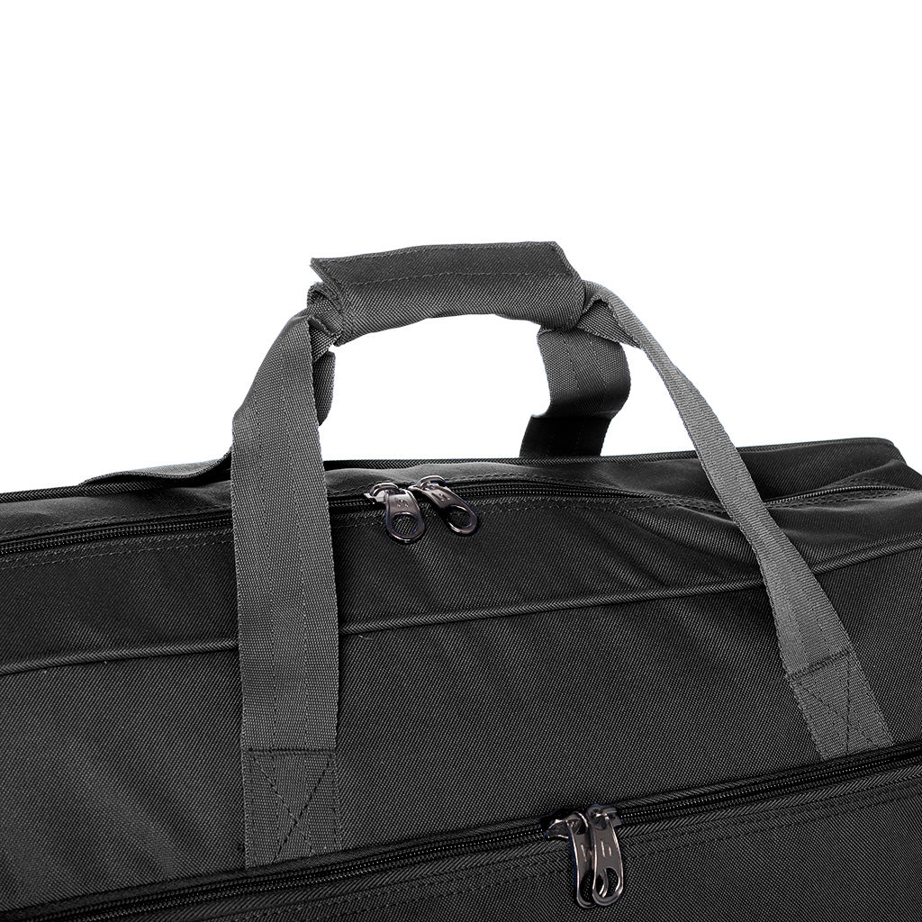 Harlequin Sports Bag in Navy close up displaying carry handles, top zip compartment, front lower zip compartment and shoulder strap.