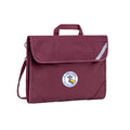 Harlequin Safety Library bag in maroon displaying carry handle, velcro opening, shoulder strap, reflector safety strip, reinforced corners and St Anne's Catholic Primary School logo
