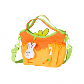 Orange Step-By-Step carrot shoulder bag front angle view displaying top pocket, handle, shoulder strap, three small front pockets and toy rabbit