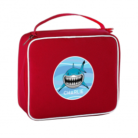 Harlequin lunch bag in red displaying carry handle,  durable water repellent and personalisation of a shark